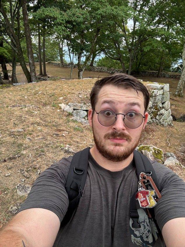 Noah Schuster taking a selfie inside the upper castle at Takatori