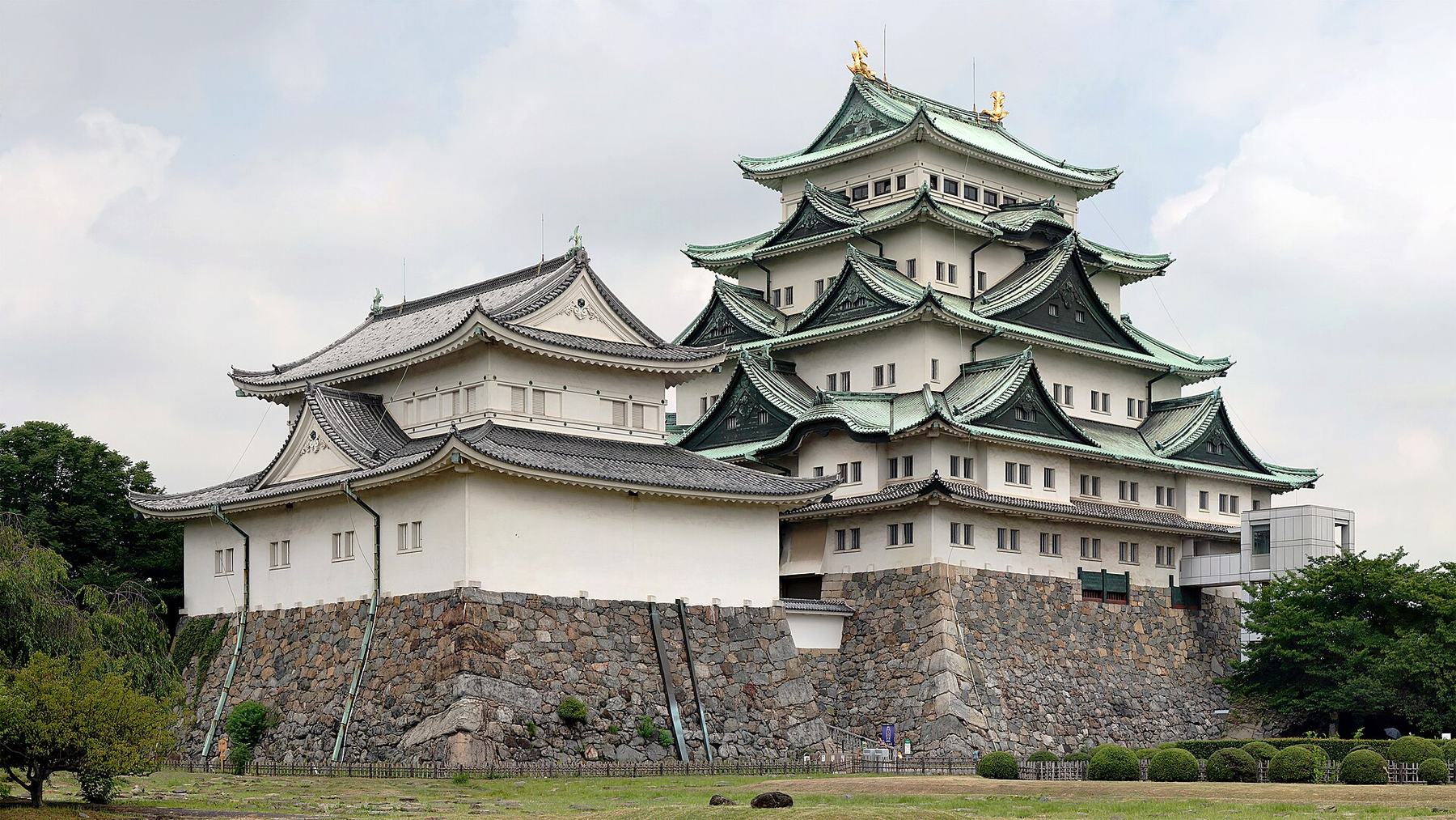 The main keep of Nagoya Castle with its golden shachihoko, above the stone base
